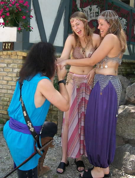 Kerri and Merri delight in the attentions of one of the Pirate Protectors of Por